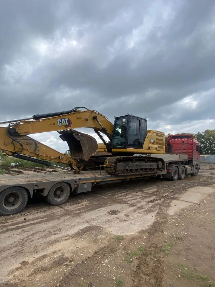 CAT экскаватор на трале